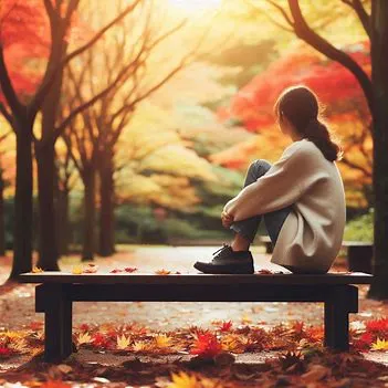 دختری افسرده روی نیمکت پارک. درمان افسردگی